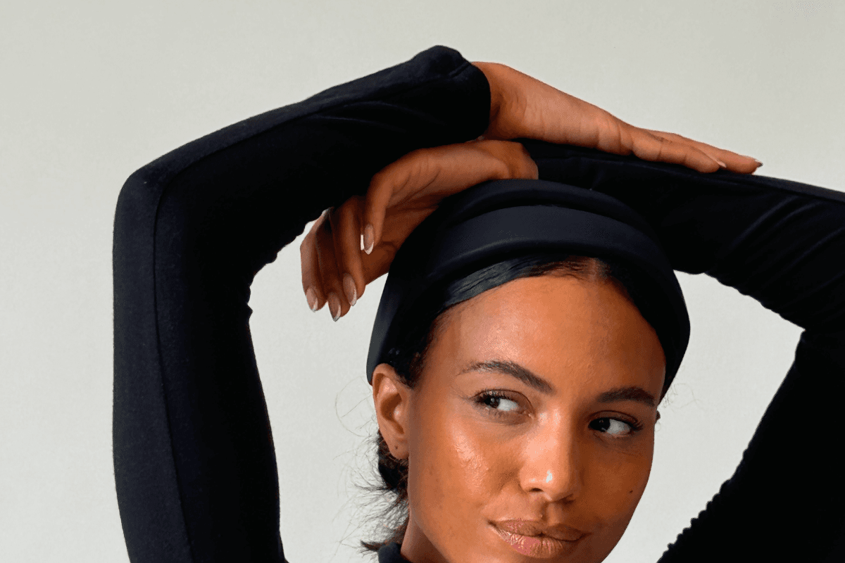 Close-up portrait of a woman wearing the Samphire Headband