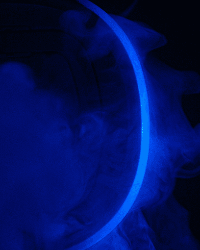 Black image with blue fluorescent line in semi-circle.